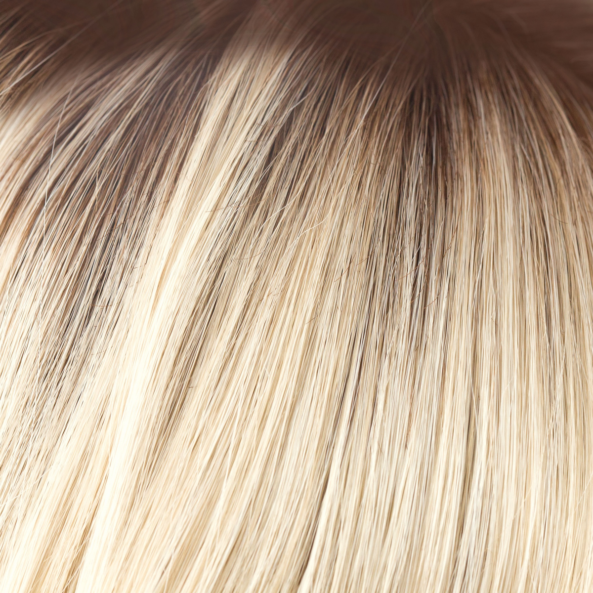 Champagne-R  -  A luxurious color with many fine tones of blond. Cream blonds, champagne hues and pale gold undertones make the blond a work of art! The medium warm brown root gives it the most natural of regrowths and keeps it looking very realistic.