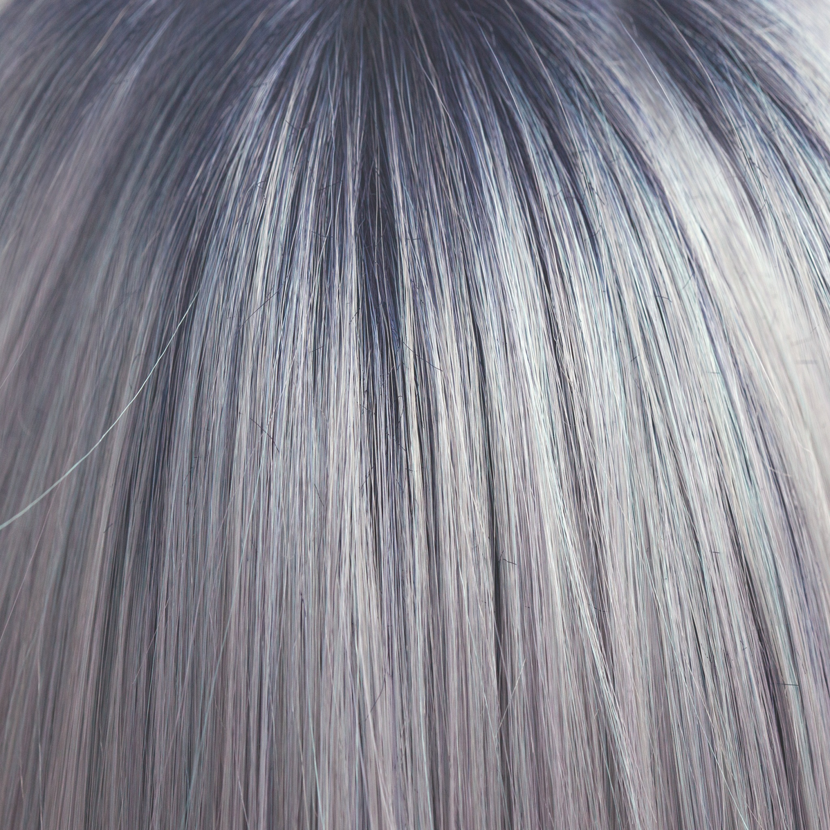 Pastel Blue-R  -  A cool pale pastel blue with hues of white. This Pastel Blue-R color has the palest of mineral blue highlights and silver shadows graduating from a dark blue sapphire root giving depth and definition.